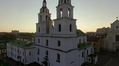 Sunset above the church, sun rays glitter in the lence Stock Footage 68942018