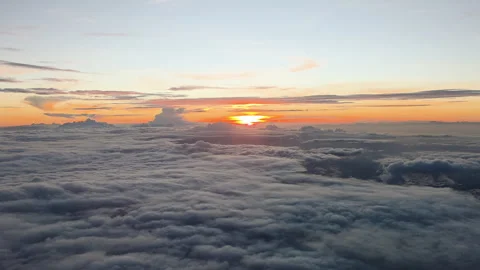Sunset above cloud inversion layer over Taiwan with stratocumulus and cirrus Stock Footage 334577450