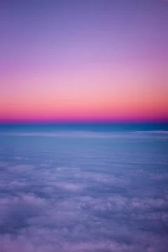 Sunset above the clouds Stock Photos
