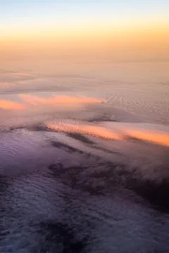 Sunset above the clouds Stock Photos