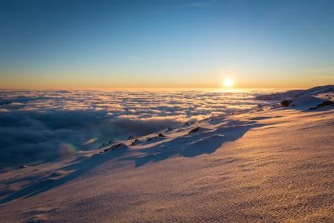 Sunset above the clouds. Winter inversion in National Park Low Tatras, Slovak Stock Photos