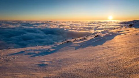 Sunset above the clouds. Winter inversion in National Park Low Tatras, Slovak Stock Photos
