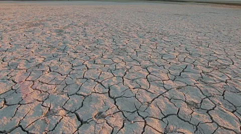Sunset above drought disaster, dry soil. Climate change, global warming Stockbeeldmateriaal 68056750