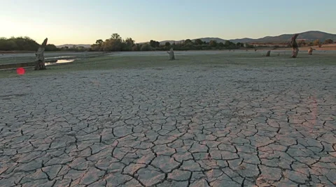 Sunset above drought disaster, dry soil. Climate change, global warming Stock Footage 68056882