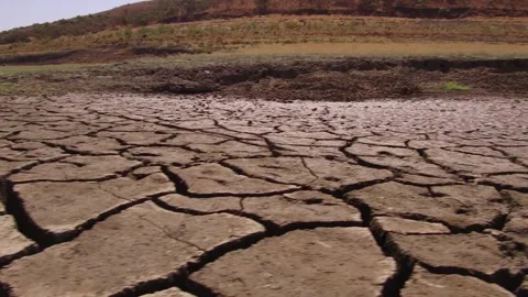 Sunset above drought disaster hot weather dry soil. Climate change global 動画素材 334029410