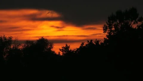The sunset above forest (strong zoom, time lapse) Stock Footage 11392641