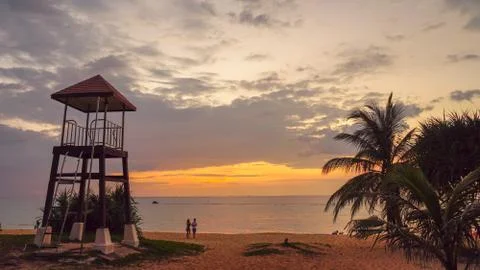 Sunset above guard tower at Karon beach Phuket Foto stock