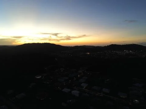 Sunset above a hill Stock Photos