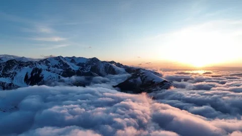 Sunset above mountain clouds from aerial view Stock Footage 312517443