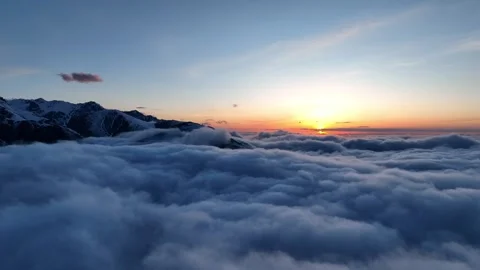 Sunset above mountain clouds from aerial view Stock Footage 312517522