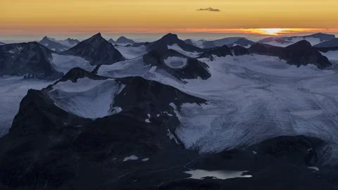 Sunset above the mountain glacier Stock Footage 250434039