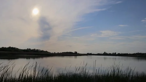 Sunset above the pond with cloudy sky at summer. Stock Footage 108858422