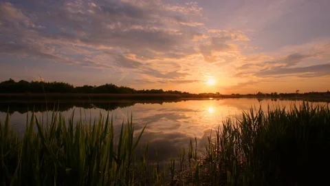 Sunset above the pond with cloudy sky at summer. Stock Footage 108858434