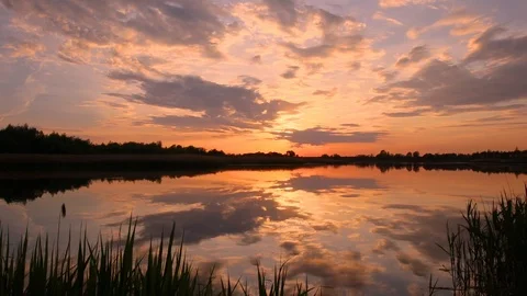 Sunset above the pond with cloudy sky at summer. Stock Footage 108858485