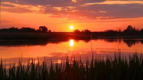 Sunset above the pond with cloudy sky at summer. Stock Footage 108858491