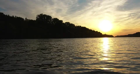 Sunset above rippling surface of Tisza with long-tailed mayflies fly around Stock Footage 263053059