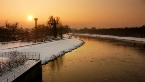 Sunset above river in winter Stock Photos