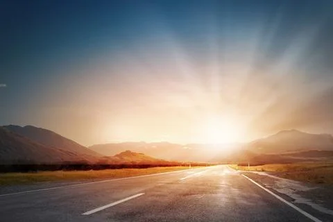 Sunset above road Stock Photos