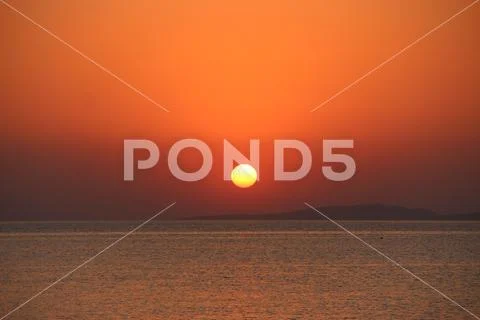 Sunset above sea. Beautiful summer decline above ocean Stock Photos