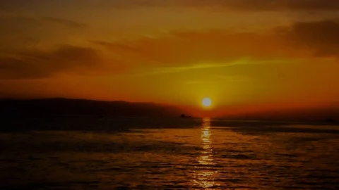 Sunset above the Sea Golden Clouds - Time lapse Stock Footage 123767642