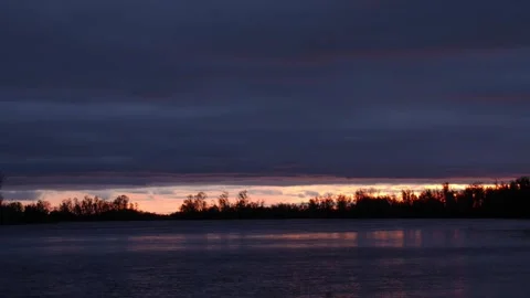 Sunset above Siberian river timelapse Stock Footage 281870733