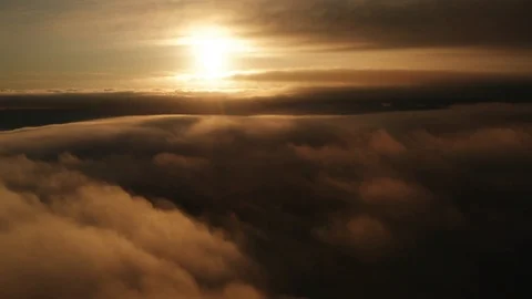 Sunset aerial background above clouds dark clouds and foggy scene Stock Footage 118594859