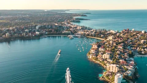 Sunset aerial drone hyperlapse of ferries from Sydney CBD docking at Manly Wharf Stock Footage 132882849