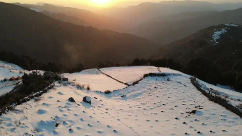 Sunset aerial drone shot. camera moving forward to sun, mountains and valley  Stock Footage 157971782