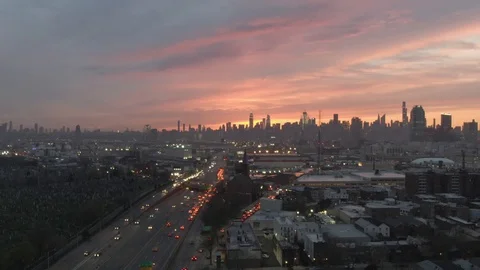 Sunset aerial drone shot of New York City skyline, quick dolly Stock Footage