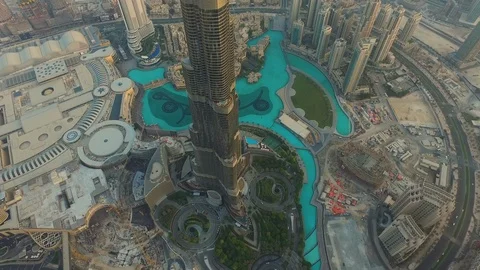 Sunset Aerial drone view of Burj Khalifa skyscraper tower in Dubai downtown Stock Footage