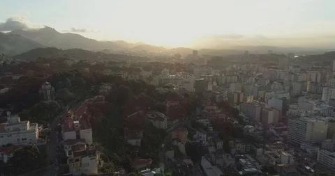 Sunset aerial over central downtown Rio de Janeiro Brazil from leafy hilltop Stock Footage 101730183