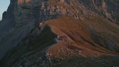 Sunset aerial over distant refugee camp at Tymfi mountain, atmospheric view Stock Footage 320955666