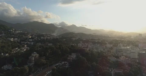 Sunset aerial pan over central downtown Rio de Janeiro Brazil from leafy hilltop 스톡 동영상 101730196