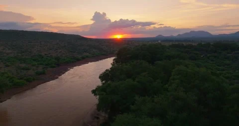 Sunset Aerial push over Ewaso Nyiro river, Samburu National Reserve, Kenya Video stock 245230880