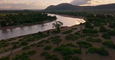 Sunset aerial push tilt over river, Samburu National Reserve, Kenya 스톡 동영상 245231246