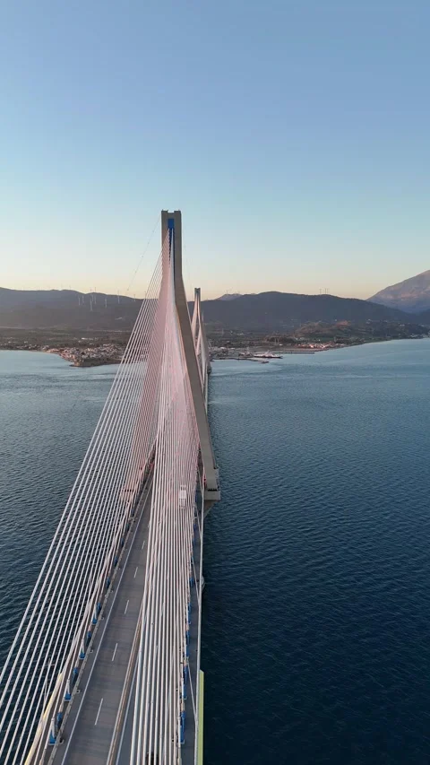 Sunset aerial vertical view of the Rio Antirrio bridge Video stock 304320222