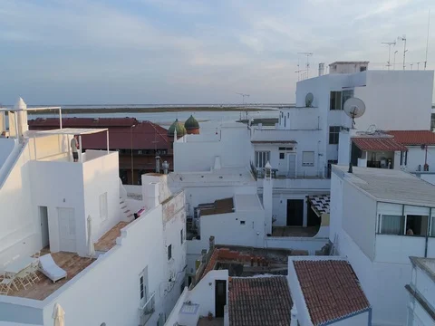 Sunset aerial view of fishing village Olhao, cubist architecture. (Crane Up) Stock Footage