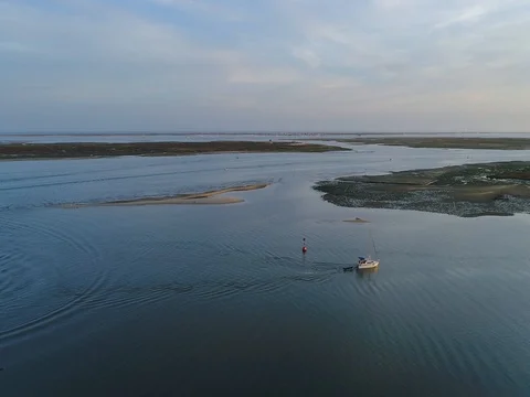 Sunset aerial view of fishing village Olhao, Market waterfront. (Pull Back) Stock Footage