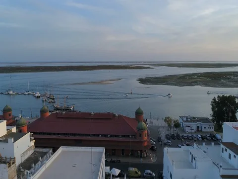 Sunset aerial view of fishing village Olhao, Market waterfront. (Push Forw) Stock Footage