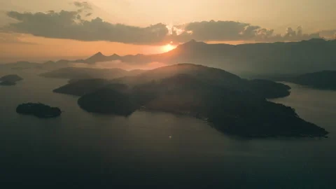 Into The Sunset, Aerial view of Islands Backlit Clouds, 4k Stock Footage 239686545