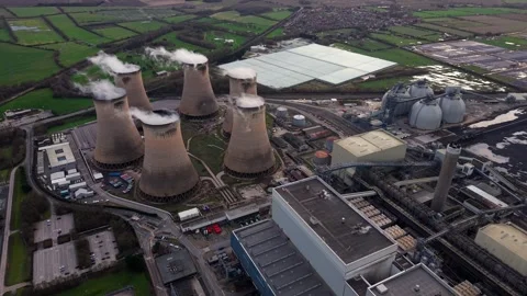 Sunset aerial view of a large renewable energy plant and industrial cooling Stock Footage 339047276