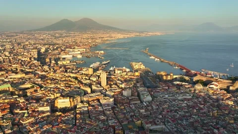 Sunset aerial view of Naples, flying above Italian city of Naples and gulf of Stock Footage 214392877