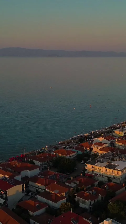 Sunset Aerial View Over Coastal Town and Sea in Greece Stock Footage 342238225