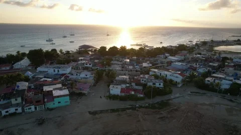 Sunset aerial view over flight gran roque town Stock Footage 296816818