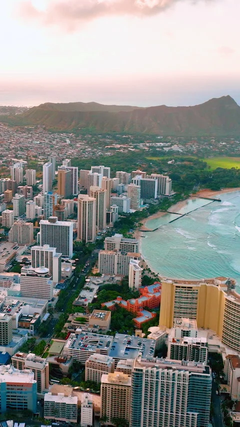 Sunset aerial view over Honolulu city and Diamond Head. Vertical video. Stock Footage 328931784