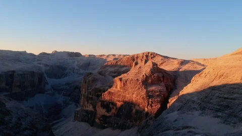 Sunset aerial view over rugged peaks near Piz Boè, Dolomites, Italy Stock Footage 312271920