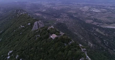 Sunset Aerial view of the Pic St Loup in Occitanie South of France Stock Footage 196808643