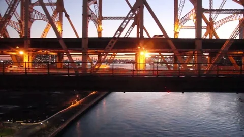 Sunset aerial view of Queensboro Bridge and East River (left to right shot) Stock Footage 70140512