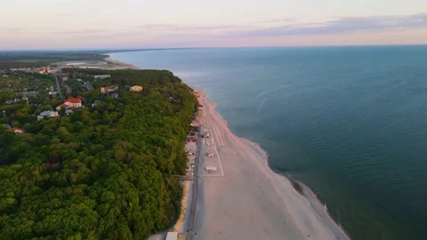 Sunset aerial view of sandy beach on the sea coast and forest on the Baltic sea Stock-Footage 155711270