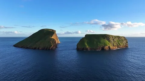 Sunset aerial view of scenic Cabras Islets off Terceira coastline in Azores 動画素材 328525314